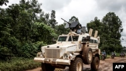 FILE: A military truck of the United Nations Organization and Stabilization Mission in the Democratic Republic of the Congo (MONUSCO) patrols on the road linking Beni to Mangina on August 23, 2018 in Beni, in the North Kivu province