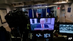 FILE - In a recorded video message, then-President Donald Trump delivers a statement after rioters stormed the Capitol building during the electoral college certification of Joe Biden as president, Jan. 6, 2021, in Washington.