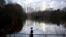 FILE - Atlanta's Piedmont Park provides a fishing spot on a 70-degree day on Feb. 22, 2018. A new study says most millennials live within 100 miles of where they grew up, with Atlanta being the city most young Black adults move to farther from their hometown.