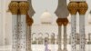 A child runs ahead of Friday prayer at the Sheikh Zayed Grand Mosque in Abu Dhabi, United Arab Emirates.