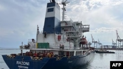 This handout picture taken and released by the Turkish Defense ministry press office on August 1, 2022, shows the Sierra Leone-flagged dry cargo ship Razoni, carrying a cargo of 26,000 metric tons of corn, departing from the Black Sea port of Odesa.