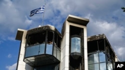 Damaged offices are seen at the headquarters of Real Group, a media organization, in the northern Athens suburb of Maroussi, Greece, July 13, 2022. 