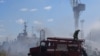 Firefighters work at a site of a Russian missile strike in a sea port of Odesa, as Russia's attack on Ukraine continues, Ukraine, July 23, 2022.