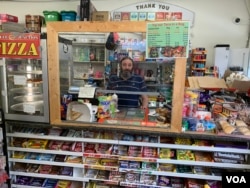 Elias Habib works behind the counter of Jubilee Junction in Halifax, Nova Scotia. (Jay Heisler/VOA)