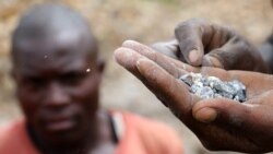 FILE—A miner show coltan at a mine in Rukunda, Masisi territory, North Kivu Province of Democratic Republic of Congo, December 2, 2018.