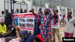 FILE - Relatives of the Abuja-Kaduna train kidnapping victims protest, following a threat from the abductors to kill the victims if demands are not met, at the Ministry of Transportation, in Abuja, Nigeria, July 25, 2022.