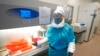 Microbiologist Annette Atkinson is pictured during a demonstration of how monkeypox is tested for at the Utah Public Health Laboratory, July 29, 2022, in Taylorsville, Utah.