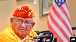 FILE - In this 2013 photo, Navajo Code Talker Samuel Sandoval talks about his experiences in the military in Cortez, Colo. 