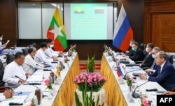 A handout picture taken and released by the Russian Foreign Ministry press service on August 3, 2022, shows Russian Foreign Minister Sergei Lavrov (R) during his meeting with Myanmar Foreign Minister Wunna Maung Lwin in Myanmar. (Photo by HANDOUT / RUSSIAN FOREIGN MINISTRY / AFP)