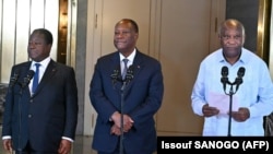 FILE: Ivory Coast President Alassane Ouattara (C) listens to former Ivorian president Laurent Gbagbo (R) next to his predecessor Henri Konan Bedie (L) after a meeting at the presidential palace in Abidjan on 7.14.2022