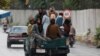 Taliban fighters drive a car on a street following the killing of al-Qaida leader Ayman al-Zawahiri in a U.S. strike over the weekend, in Kabul, Afghanistan, Aug. 2, 2022.