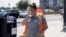 Vangie Jacobo wipes her face with a wet rag while working outside in 106° F heat in Phoenix, Arizona, July 23, 2022.