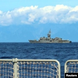 A Taiwan military vessel is seen from a Navy Force vessel under the Eastern Theatre Command of China's People's Liberation Army (PLA) during the navy's military exercises in the waters around Taiwan, at an undisclosed location in this Aug. 5, 2022 handout image. (Eastern Theatre Command/Handout via REUTERS)