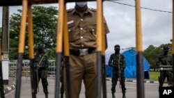 Security stands guard outside the Parliament building in Colombo, Sri Lanka, Wednesday, July 20, 2022. Lawmaker elected Ranil Wickremesinghe as the country's new president. (AP Photo/Rafiq Maqbool)
