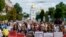 Protesters attend a rally in support of Ukrainian soldiers from the Azov Regiment who were captured by Russia in May after the fall of Mariupol, in Kyiv, Ukraine, Saturday, July 30, 2022.