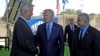 U.S. President Joe Biden (C), Israeli caretaker Prime Minister Yair Lapid (R) and Defense Minister Benny Gantz, stand in front of Israel's Iron Dome defense system during a tour at Ben Gurion Airport near Tel Aviv, July 13, 2022. 