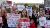 Protesters attend a rally in support of Ukrainian soldiers from the Azov Regiment who were captured by Russia in May after the fall of Mariupol, in Kyiv, Ukraine, Aug. 4, 2022.