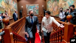 Secretary of State Antony Blinken, center left, arrives for a meeting with Philippine President Ferdinand Marcos Jr. at the Malacanang Palace in Manila, Philippines, Aug. 6, 2022. 