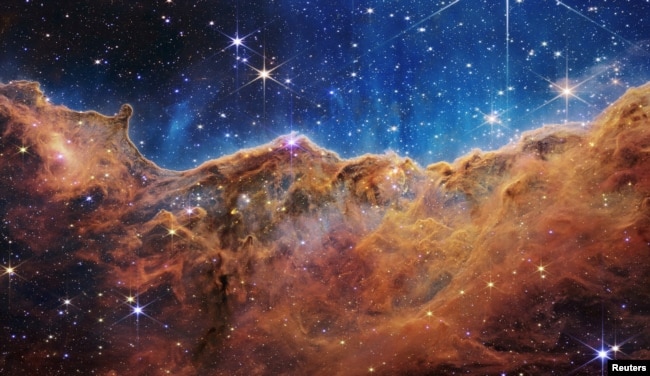 The "Cosmic Cliffs" of the Carina Nebula are seen in this image, captured by NASA's James Webb Space Telescope and released on July 12, 2022. (Image Credit: NASA, ESA, CSA, STScI, Webb ERO Production Team/Handout via REUTERS)