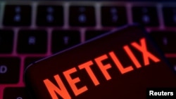 FILE: Smartphone with Netflix logo is placed on a keyboard in this illustration taken 4.19.2022. 