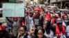 Protesters chant slogans while marching during a protest to demand peaceful elections and justice for victims of post-election violence in Nairobi, Kenya, on June 23, 2022.