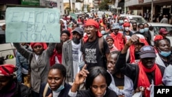 Protesters chant slogans while marching during a protest to demand peaceful elections and justice for victims of post-election violence in Nairobi, Kenya, on June 23, 2022.