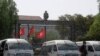 Tunisian police stand guard outside the parliament in Tunis on July 27, 2021.