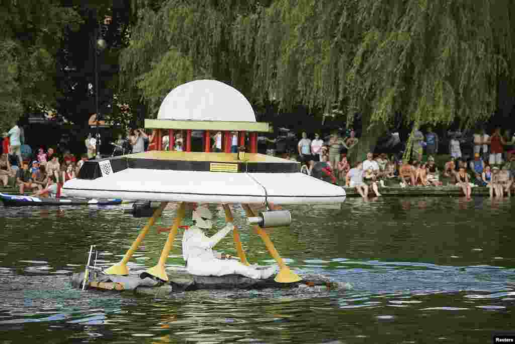 Competitors take part in the &quot;Sailing on Anything&quot; floating championship in Augustow, Poland, July 27, 2014.