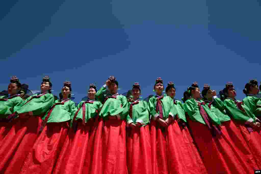 Young women wearing traditional hanbok dress attend a traditional Coming-of-Age Day ceremony to mark adulthood at Namsan hanok village in Seoul, South Korea.