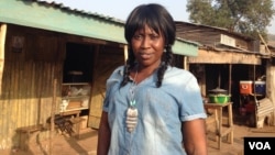 Mariatu Sesay stands in front of her cafe which she runs and also teaches catering skills to sex workers there. Goderich, Sierra Leone, Jan. 17, 2018 (N.deVries/VOA)