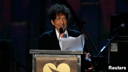 FILE - Musician Bob Dylan speaks at the 2015 MusiCares Person of the Year tribute honoring Bob Dylan in Los Angeles, California, Feb. 6, 2015. 