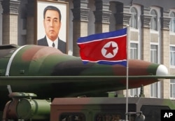 FILE - What appears to be a new missile is displayed during a military parade at the Kim Il Sung Square in Pyongyang, North Korea, April 15, 2012.