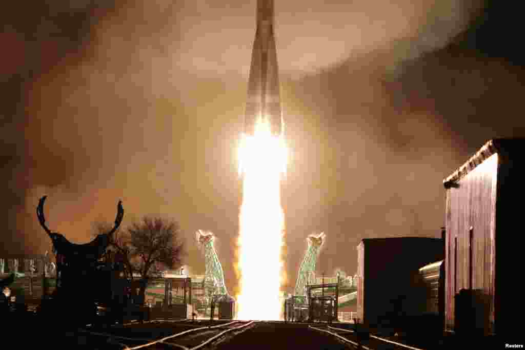 A Soyuz-2.1b rocket booster with a Fregat upper stage and satellites of British firm OneWeb blasts off from a launchpad at the Baikonur Cosmodrome, Kazakhstan.
