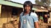 Mariatu Sesay stands in front of her cafe which she runs and also teaches catering skills to sex workers there. Goderich, Sierra Leone, Jan. 17, 2018 (N.deVries/VOA)