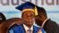 Zimbabwe's President Robert Mugabe, center-right, arrives to preside over a student graduation ceremony at Zimbabwe Open University on the outskirts of Harare, Zimbabwe Friday, Nov. 17, 2017. Mugabe is making his first public appearance since the military put him under house arrest earlier this week. (AP Photo/Ben Curtis)