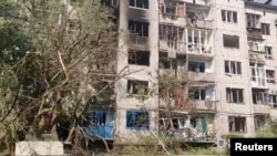 A general view of damaged buildings in the aftermath of shelling, as Russia's attack on Ukraine continues, in the Donetsk region, in this screengrab taken from a video released June 13, 2022. (National Police of Ukraine/Handout via Reuters)