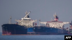 The Liberian-flagged oil tanker 'Ice Energy' (L) transfers crude oil from the Russian-flagged oil tanker 'Lana' (R) (former 'Pegas'), off the shore of Karystos, on the Island of Evia, May 29, 2022.
