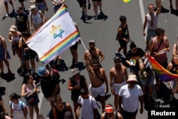 People take part in annual gay pride parade as it returns to full-scale after two years of COVID in Tel Aviv, Israel June 10, 2022 REUTERS/Amir Cohen