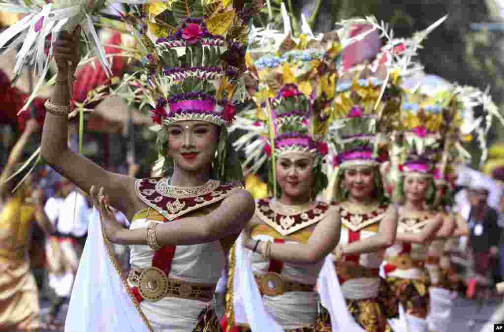 Female dancers perform during the opening of Bali Arts Festival in Bali, Indonesia.
