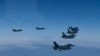 U.S. and South Korea Air Force fighter jets fly in formation during a joint drill on June, 7, 2022. The South Korean and U.S. militaries flew 20 fighter jets over South Korea's western sea. Photo Credit: South Korea Defense Ministry via AP.