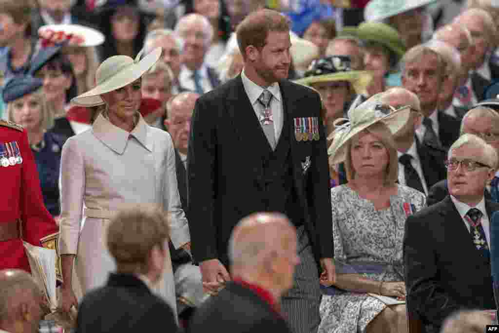 Britain's Prince Harry, Duke of Sussex, center, and Britain's Meghan, Duchess of Sussex, attend the National Service of Thanksgiving for The Queen's reign at Saint Paul's Cathedral in London.