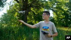 Andriy Pokrasa, 15, lands his drone on his hand in Kyiv, Ukraine, June 11, 2022. Andriy is being hailed in Ukraine for stealthy aerial reconnaissance work he has done with his father in the country's ongoing war with Russia.