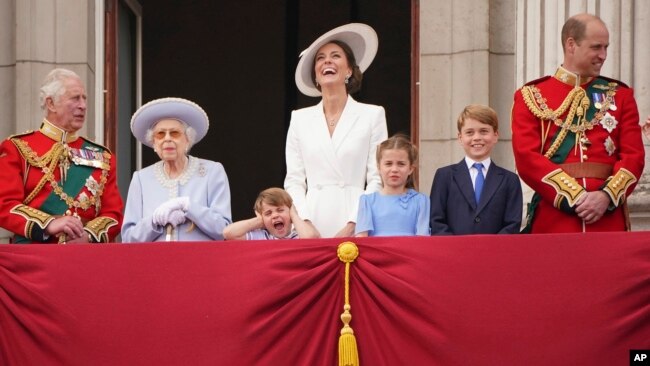 From left, Prince Charles, Queen Elizabeth II, Prince Louis, Kate, Duchess of Cambridge, Princess Charlotte, Prince George and Prince William gather on the balcony of Buckingham Palace June 2, 2022. (Jonathan Brady/Pool Photo via AP)