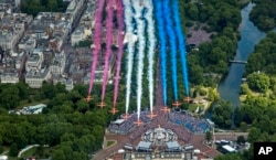 The Red Arrows during a flypast after the Trooping the Colour ceremony in London, Thursday June 2, 2022. (RAF SAC Sarah Barsby, Ministry of Defence via AP)