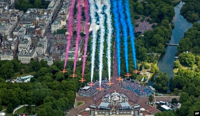 The Red Arrows during a flypast after the Trooping the Colour ceremony in London, Thursday June 2, 2022. (RAF SAC Sarah Barsby, Ministry of Defence via AP)