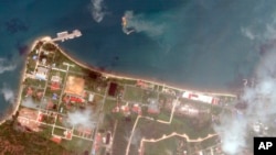 FILE - This satellite image from Planet Labs PBC shows a Cambodian naval base in Ream, Cambodia, April 25, 2022.