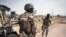 FILE: Soldiers of the Nigerian Army stand by the road in Damboa, Borno State northeast Nigeria on March 25, 2016. - On April 14, 2014, Boko Haram militants kidnapped 276 schoolgirls from their dormitories at the Government Girls Secondary School Chibok