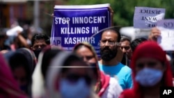 Employees of Jammu and Kashmir Teachers Association march in a protest against targeted shootings, in Jammu, India, June 2, 2022. 