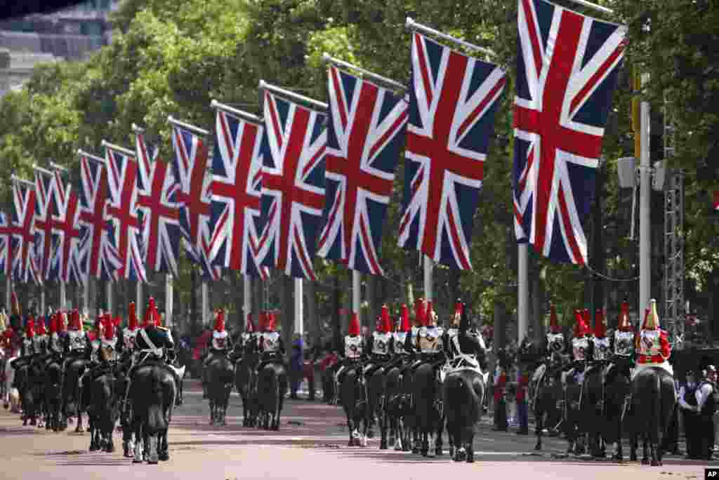 Cavalrymen ride their horses along The Mall during the Trooping the Color in London, June 2, 2022, on the first of four days of celebrations to mark the Platinum Jubilee. 