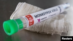 FILE - A monkeypox virus test tube marked "positive" is seen in an illustration photo taken May 22, 2022.